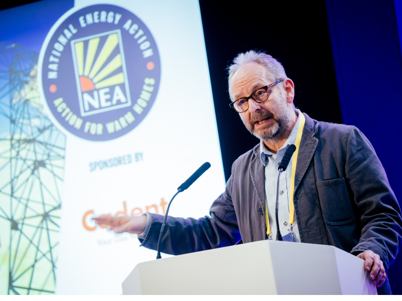 Adam Scorer, Chief Executive of National Energy Action presenting at a conference.