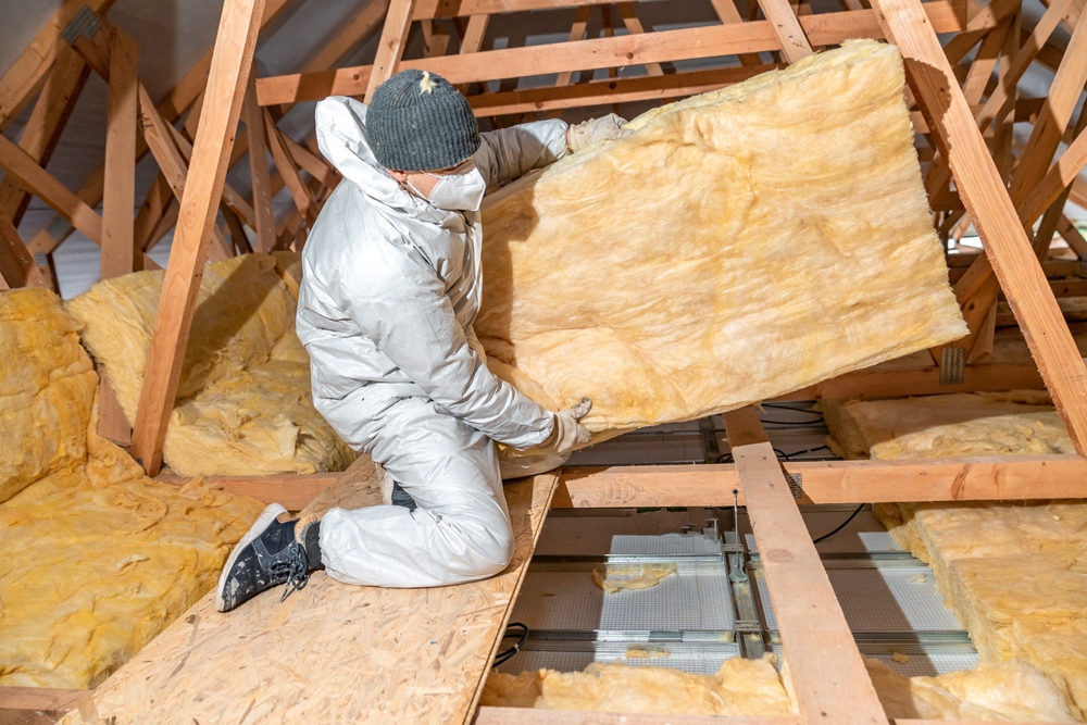 Loft insulation being installed.
